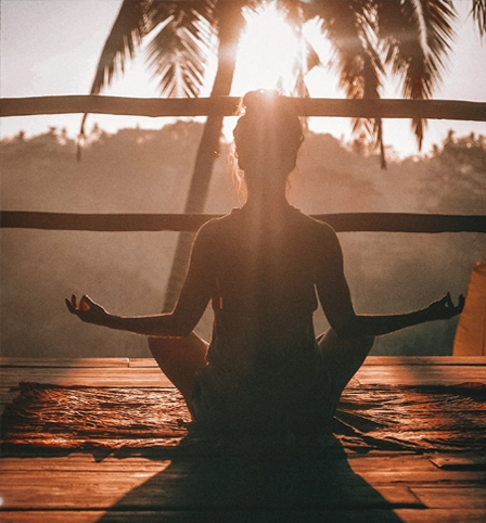 Someone meditating outdoors
