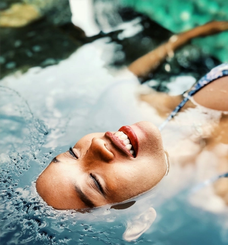 Someone laying in a pool of water with fresh skin.